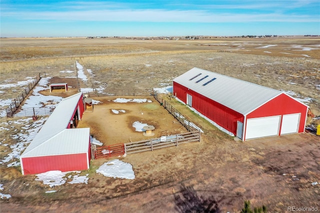 birds eye view of property with a rural view