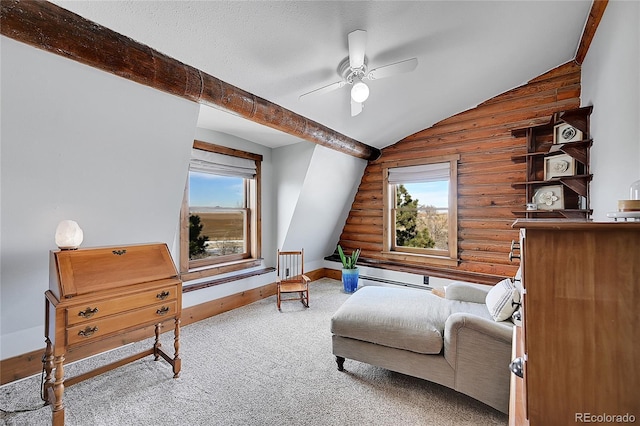 48155 E 56th Ave, Bennett, CO 80102 - carpeted living room with log walls, ceiling fan, plenty of natural light, vaulted ceiling, and baseboards