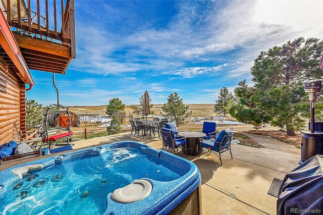 48155 E 56th Ave, Bennett, CO 80102 - view of swimming pool featuring outdoor dining space, a patio, and a hot tub
