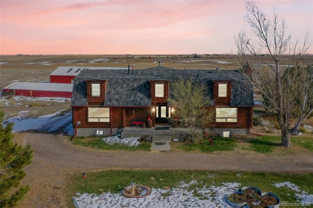 48155 E 56th Ave, Bennett, CO 80102 - log-style house featuring a shingled roof and log siding