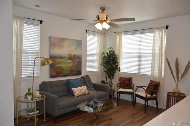 living room featuring a ceiling fan and wood finished floors