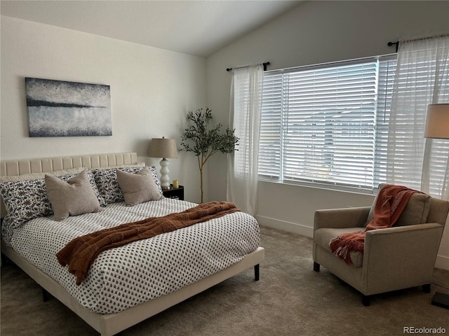bedroom featuring lofted ceiling, carpet, and baseboards