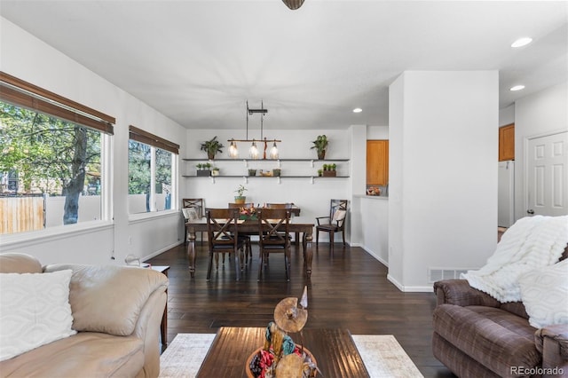 living room featuring dark wood-type flooring, recessed lighting, baseboards, and visible vents
