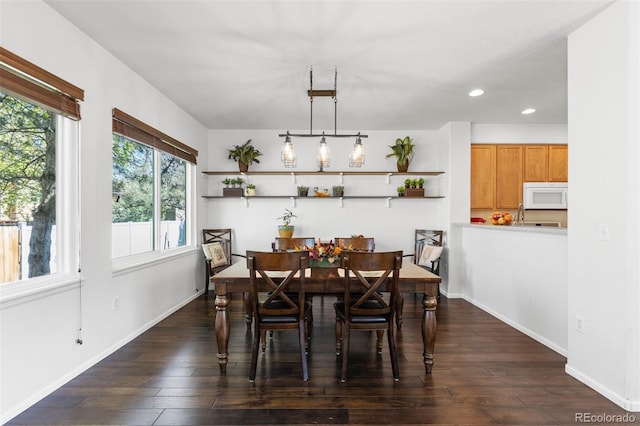 dining area featuring recessed lighting, baseboards, and dark wood-type flooring