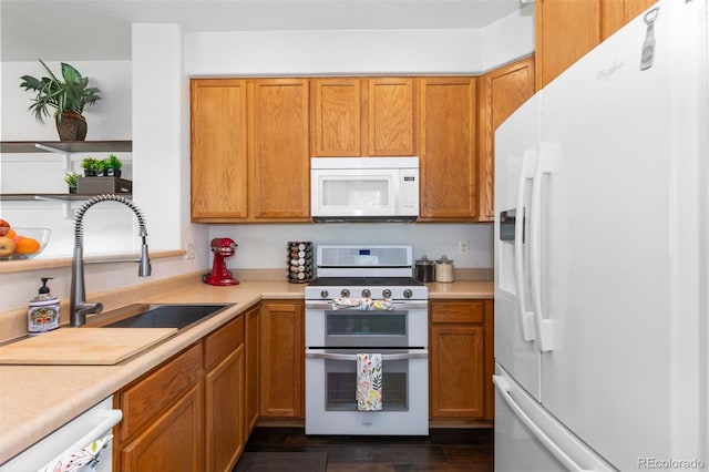 kitchen with white appliances, open shelves, a sink, and light countertops