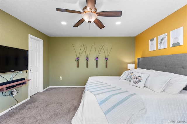 carpeted bedroom featuring recessed lighting, baseboards, a ceiling fan, and an accent wall
