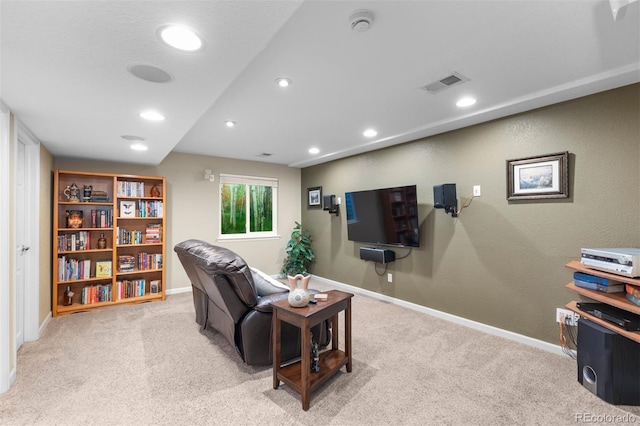living room with carpet floors, baseboards, and visible vents