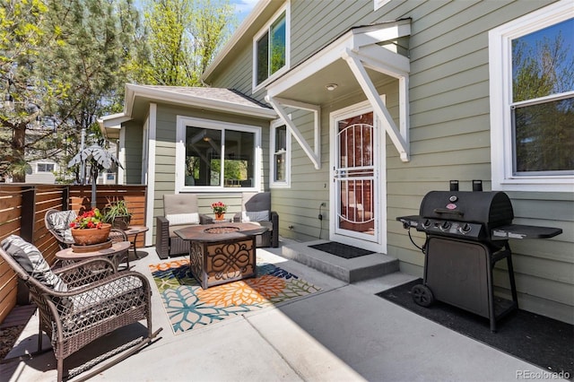 doorway to property with a patio area and fence