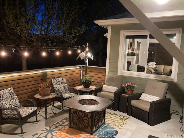 patio at night with a fire pit