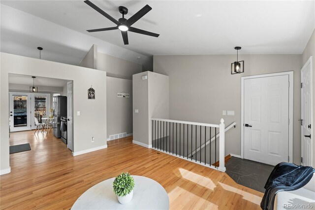 5965 Corinth Dr, Colorado Springs, CO 80923 - living room featuring lofted ceiling, wood finished floors, ceiling fan, and baseboards