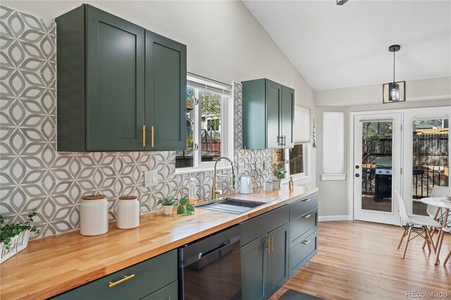 5965 Corinth Dr, Colorado Springs, CO 80923 - kitchen featuring dishwasher, a sink, green cabinetry, vaulted ceiling, and backsplash
