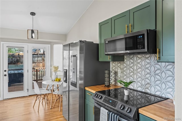 5965 Corinth Dr, Colorado Springs, CO 80923 - kitchen featuring appliances with stainless steel finishes, green cabinetry, wood counters, lofted ceiling, and decorative backsplash