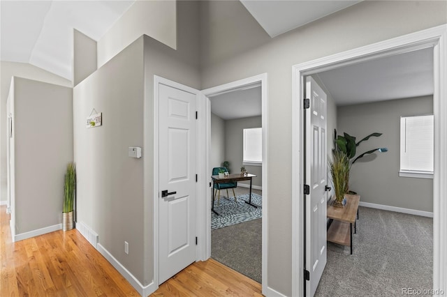 5965 Corinth Dr, Colorado Springs, CO 80923 - hall with baseboards, light wood-type flooring, and lofted ceiling