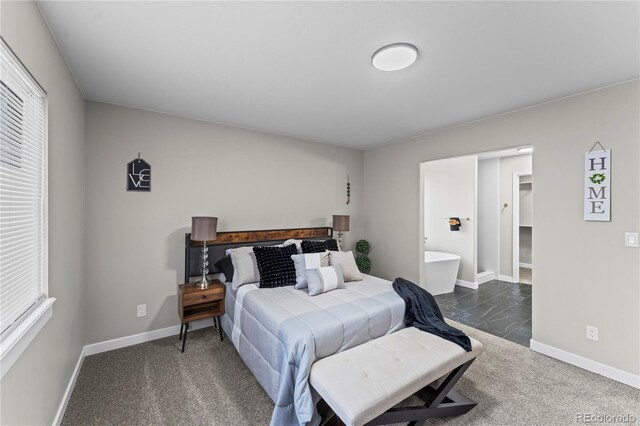 5965 Corinth Dr, Colorado Springs, CO 80923 - bedroom featuring multiple windows, baseboards, and dark colored carpet