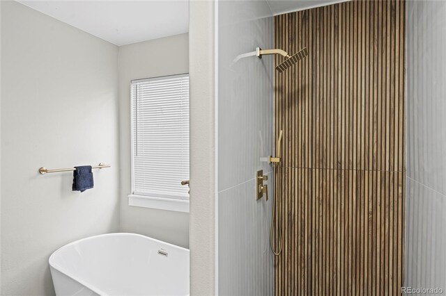 5965 Corinth Dr, Colorado Springs, CO 80923 - full bath featuring tiled shower and a freestanding tub