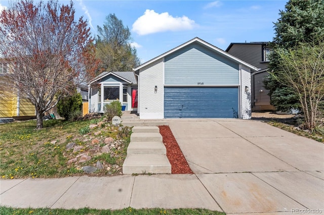 5965 Corinth Dr, Colorado Springs, CO 80923 - view of front of home featuring a garage and concrete driveway