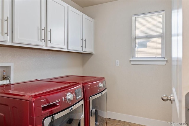 laundry room featuring cabinet space, washer and dryer, and baseboards