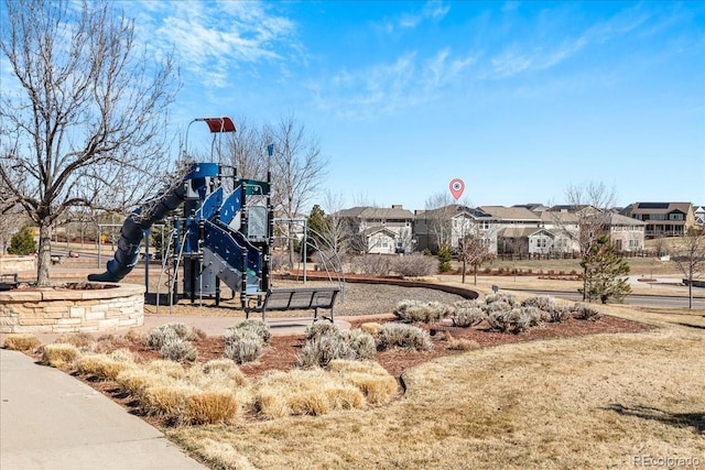 community jungle gym with a residential view