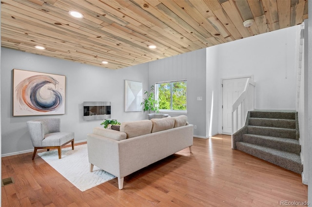 13245 Shoshone St, Denver, CO 80234 - living area featuring stairway, wood finished floors, recessed lighting, baseboards, and wooden ceiling