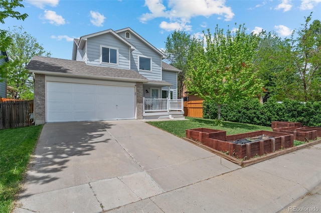 13245 Shoshone St, Denver, CO 80234 - traditional-style home featuring a garden, driveway, brick siding, and an attached garage