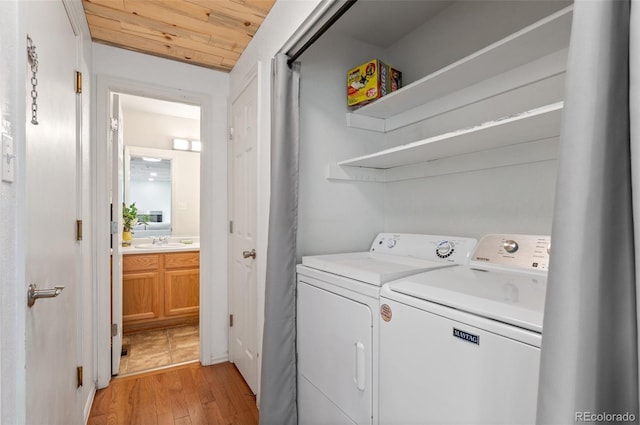 13245 Shoshone St, Denver, CO 80234 - washroom with independent washer and dryer, light wood finished floors, and wood ceiling