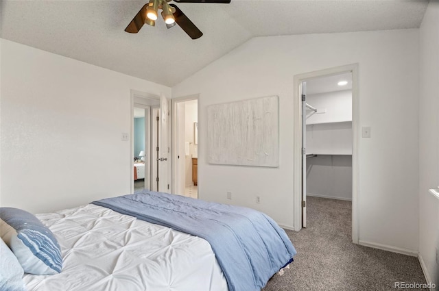 13245 Shoshone St, Denver, CO 80234 - carpeted bedroom featuring a spacious closet, vaulted ceiling, ceiling fan, a closet, and baseboards