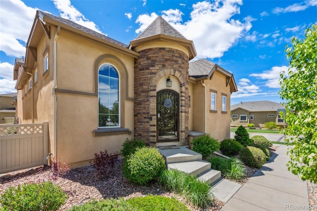8913 Sunstone Dr, Colorado Springs, CO 80924 - view of front facade featuring stucco siding and stone siding