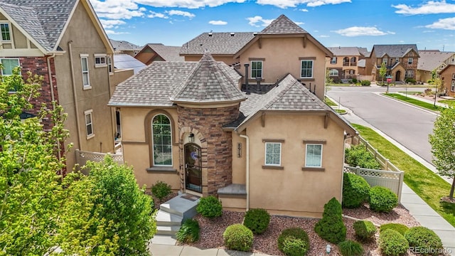 8913 Sunstone Dr, Colorado Springs, CO 80924 - view of front facade featuring stucco siding, a shingled roof, and a residential view