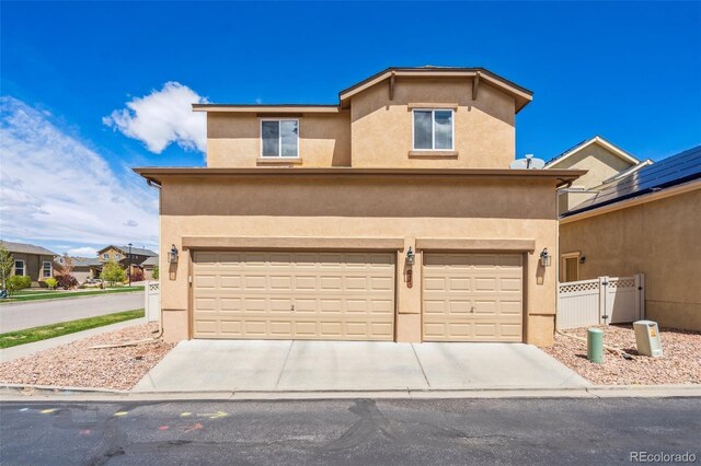 8913 Sunstone Dr, Colorado Springs, CO 80924 - traditional-style home featuring a garage, stucco siding, and driveway