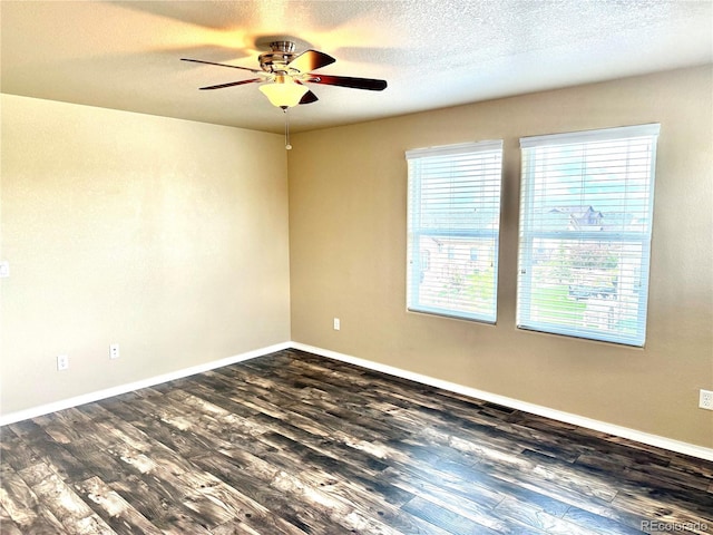 8913 Sunstone Dr, Colorado Springs, CO 80924 - empty room with a ceiling fan, dark wood finished floors, baseboards, and a textured ceiling