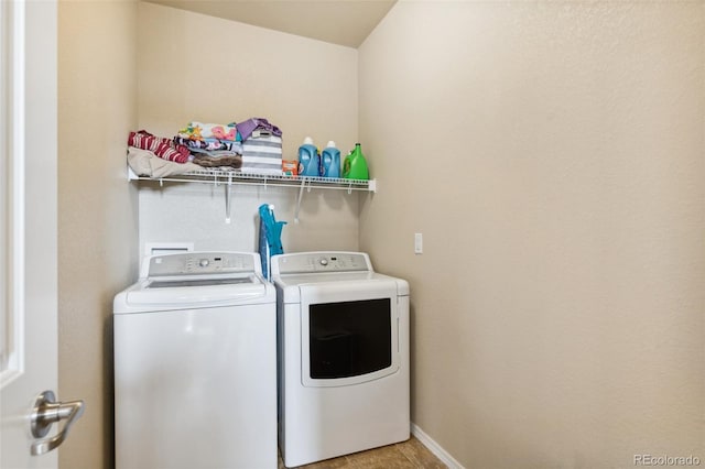 8913 Sunstone Dr, Colorado Springs, CO 80924 - laundry area featuring washing machine and dryer, baseboards, and light tile patterned floors