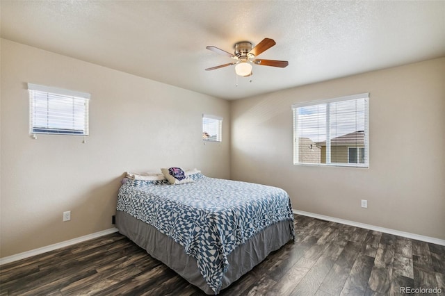 8913 Sunstone Dr, Colorado Springs, CO 80924 - bedroom with multiple windows, dark wood-type flooring, baseboards, and ceiling fan