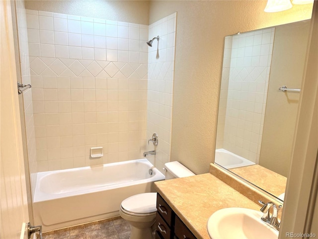 8913 Sunstone Dr, Colorado Springs, CO 80924 - bathroom featuring a textured wall, toilet, vanity, and bathing tub / shower combination