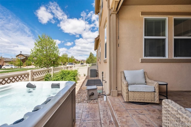 8913 Sunstone Dr, Colorado Springs, CO 80924 - view of patio with a hot tub and central AC