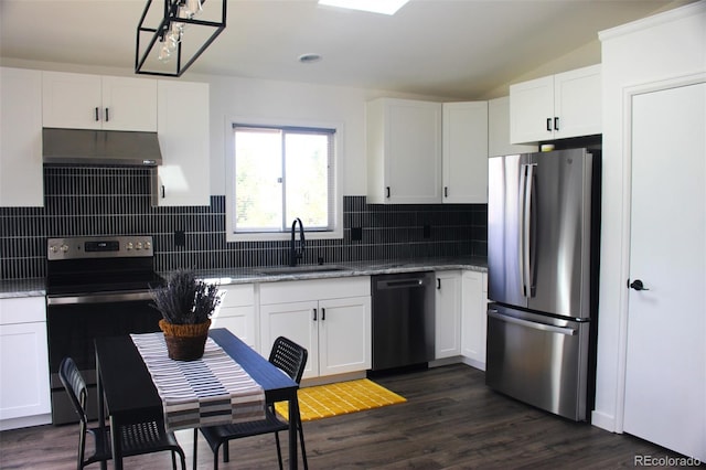 kitchen featuring tasteful backsplash, white cabinets, dark hardwood / wood-style flooring, stainless steel appliances, and sink