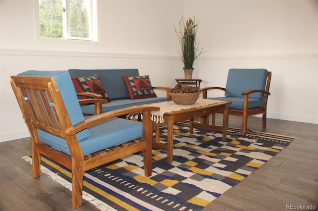 sitting room with dark hardwood / wood-style floors