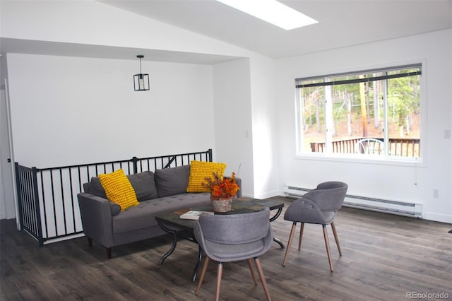 living room with lofted ceiling with skylight, dark hardwood / wood-style flooring, and a baseboard heating unit