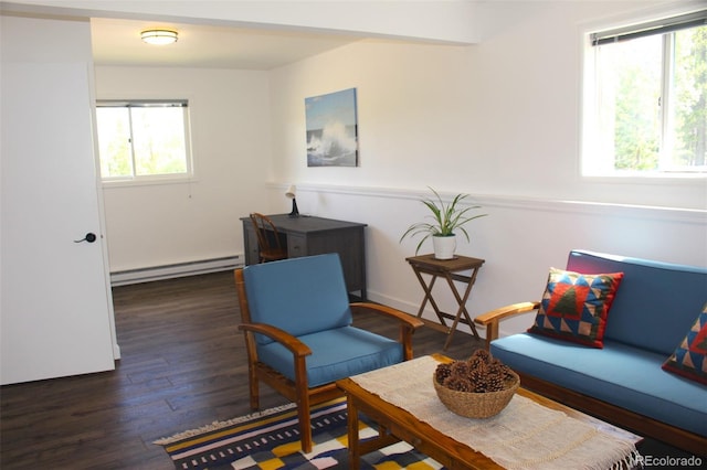 living area with a baseboard radiator and dark hardwood / wood-style floors