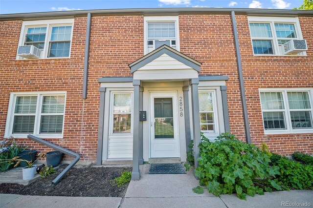 2858 Jasmine St, Denver, CO 80207 - entrance to property with brick siding and cooling unit