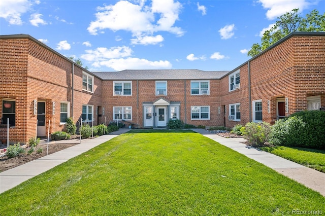 2858 Jasmine St, Denver, CO 80207 - view of property featuring a front lawn and brick siding