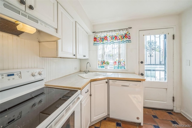 2858 Jasmine St, Denver, CO 80207 - kitchen with white appliances, a sink, under cabinet range hood, white cabinetry, and light countertops