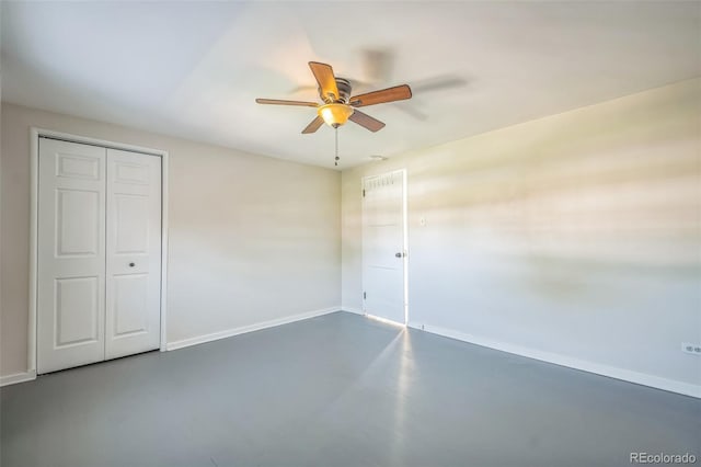 2858 Jasmine St, Denver, CO 80207 - unfurnished bedroom with baseboards, finished concrete flooring, a closet, and ceiling fan