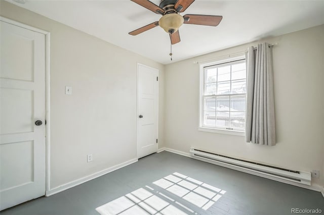2858 Jasmine St, Denver, CO 80207 - unfurnished room with a baseboard heating unit, a ceiling fan, and baseboards