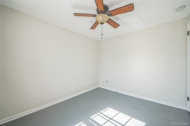 2858 Jasmine St, Denver, CO 80207 - empty room featuring ceiling fan, baseboards, and a smoke detector