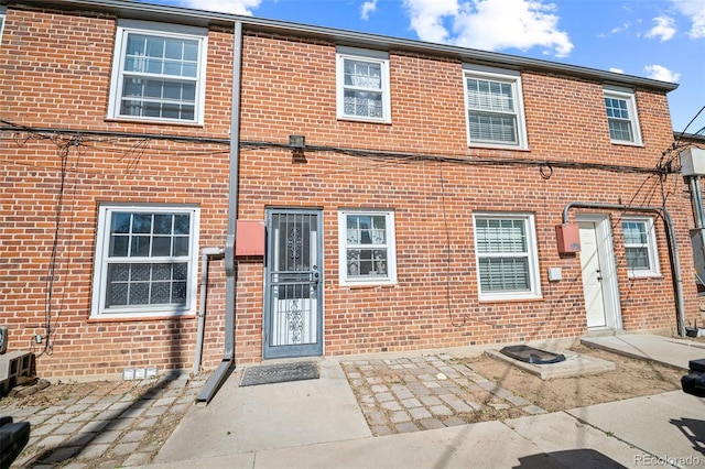2858 Jasmine St, Denver, CO 80207 - back of property with brick siding and a patio