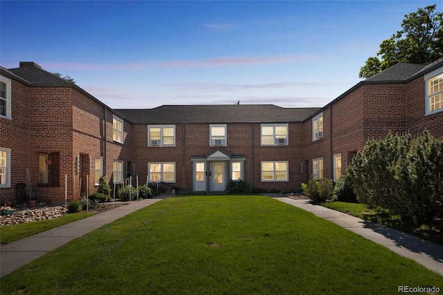 2858 Jasmine St, Denver, CO 80207 - view of front of house with a front lawn and brick siding
