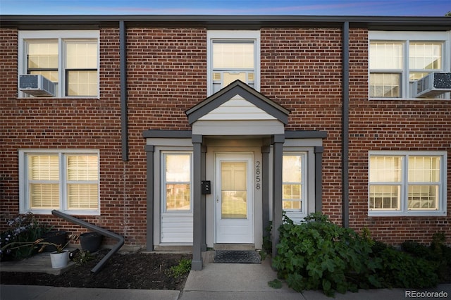 2858 Jasmine St, Denver, CO 80207 - view of front of property featuring brick siding and cooling unit