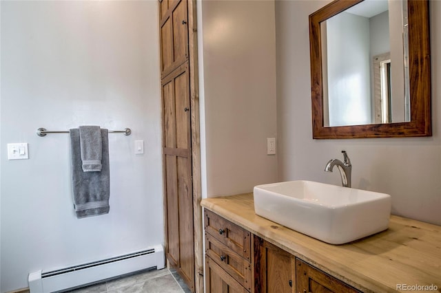 bathroom with baseboard heating and vanity