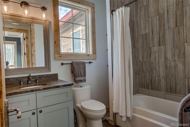 full bathroom featuring vanity, toilet, and shower / bathtub combination with curtain