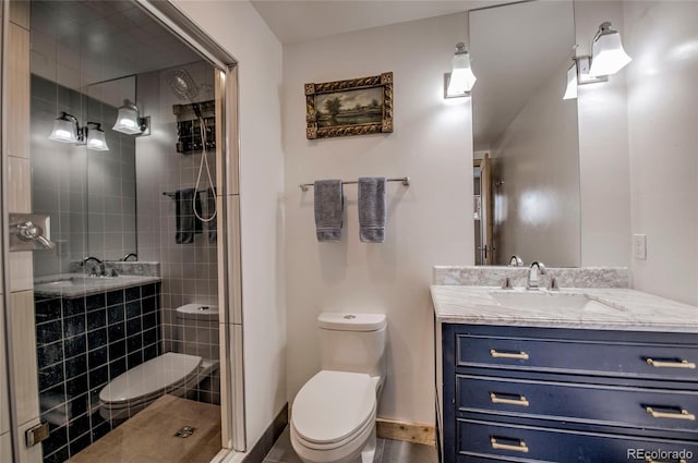 full bath featuring toilet, a stall shower, baseboards, and vanity